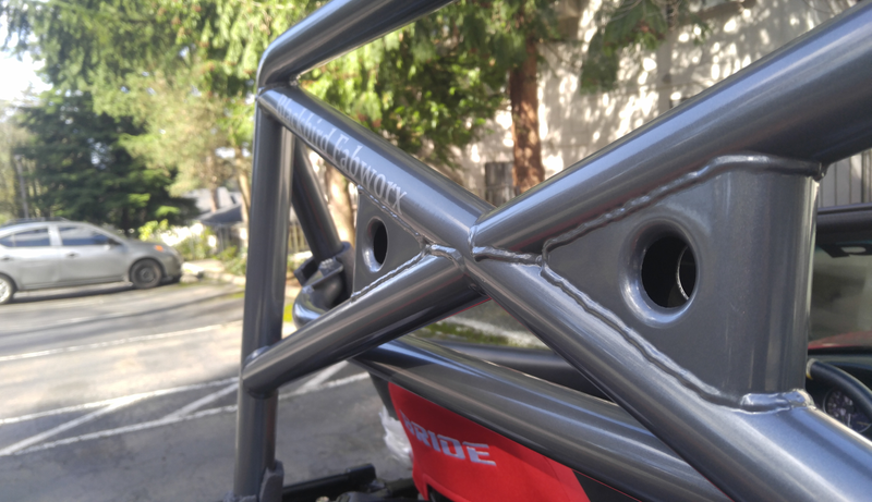 It’s a semi-glossy medium grey with a hint of metal flake